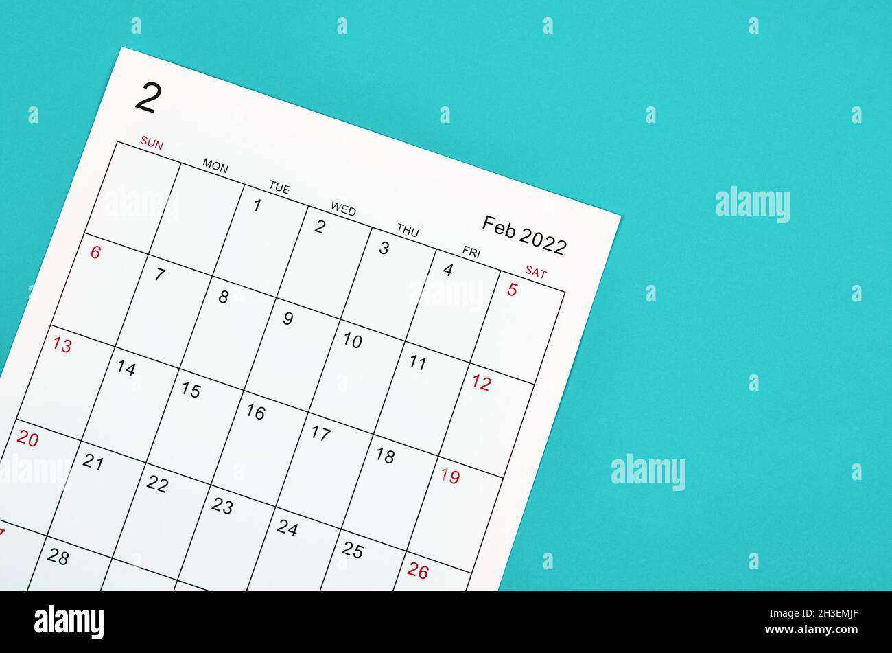 Close Up February 2022 Calendar Sheet On Green Background